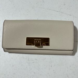 White Michael Kors wallet with gold accents